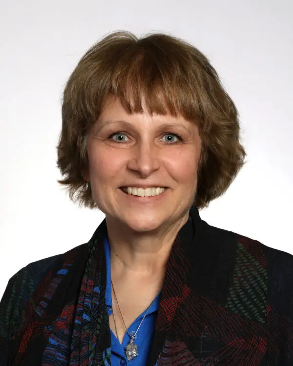 a woman smiling for a picture